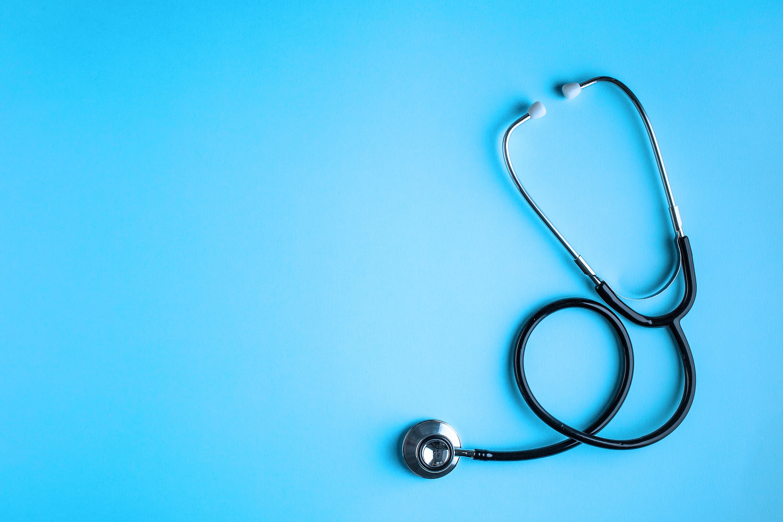 Stethoscope on a blue background.