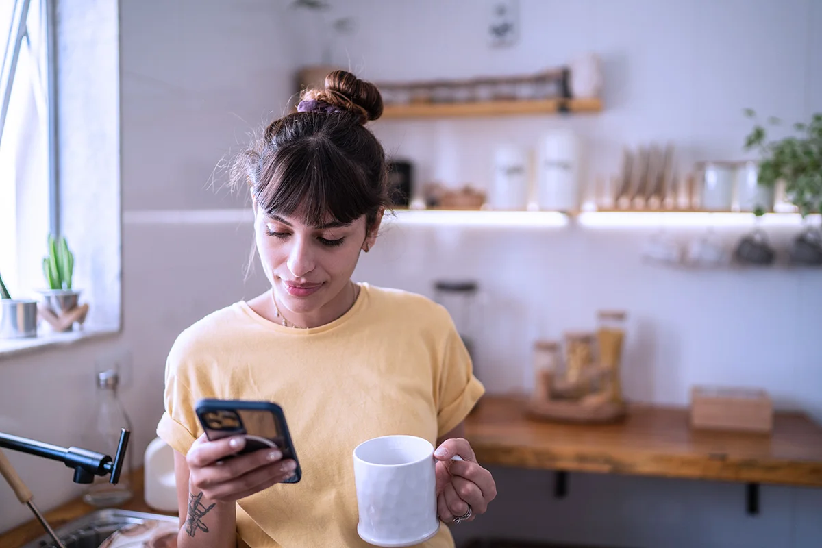 woman using a smartphone in an art studio